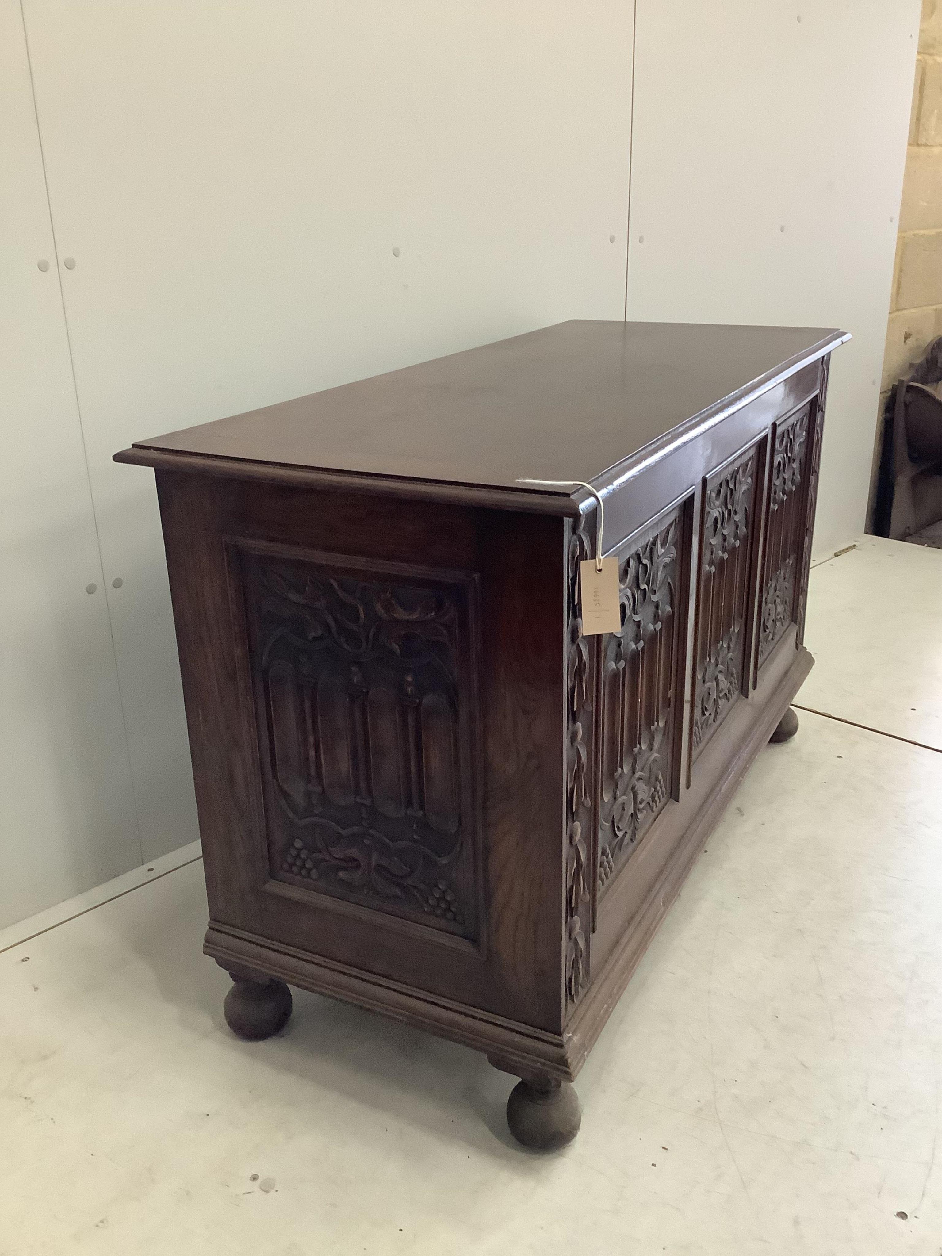 A 17th century style carved oak coffer, width 121cm, depth 52cm, height 76cm. Condition - fair